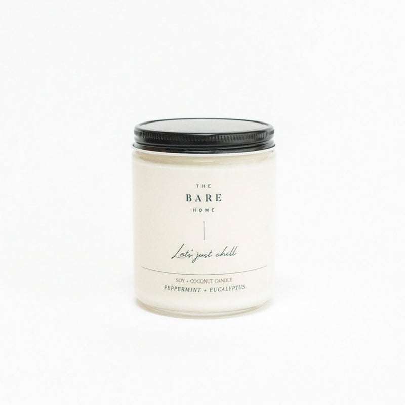 This image depicts The Bare Home Candle, a hand-poured candle made from an ethically sourced coconut + soy wax blend. Scented with essential oils and a non-toxic wick, it provides a clean burn of 50+ hours. Vegan, paraben and phthalate free.
