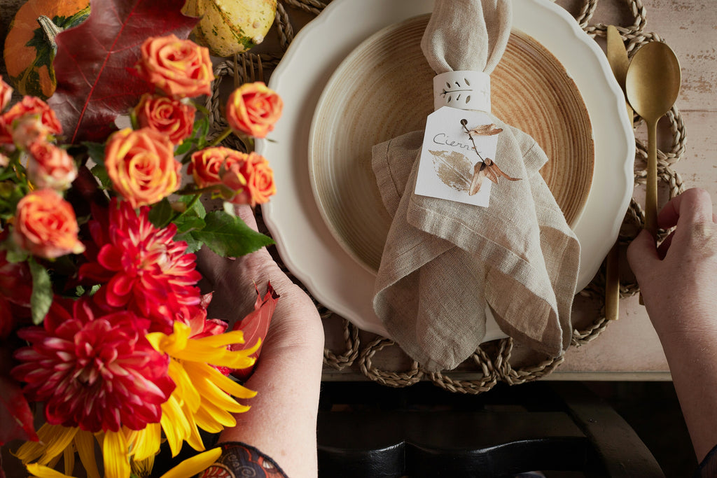 Thanksgiving flowers next to plate