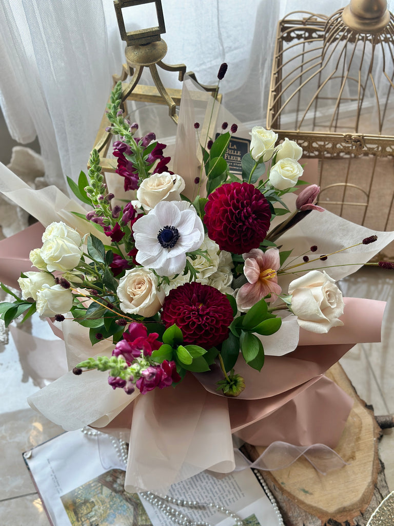 White and burgundy flower bouquet