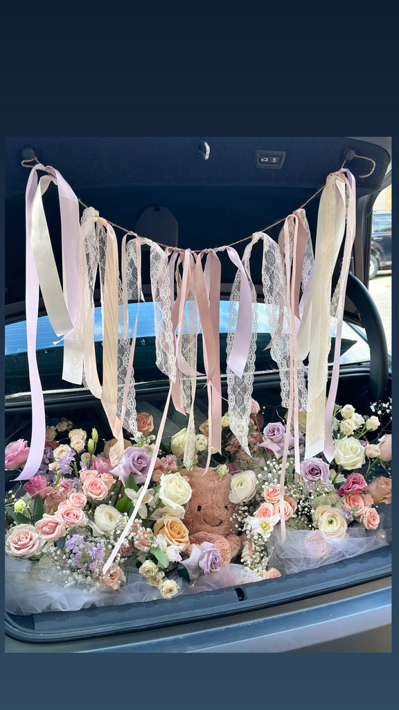 car trunk proposal flowers