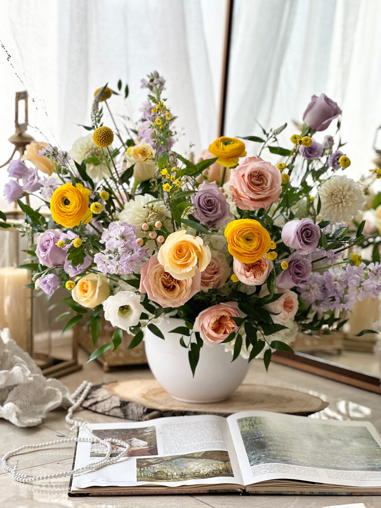 yellow lavender flower arrangement in the vase