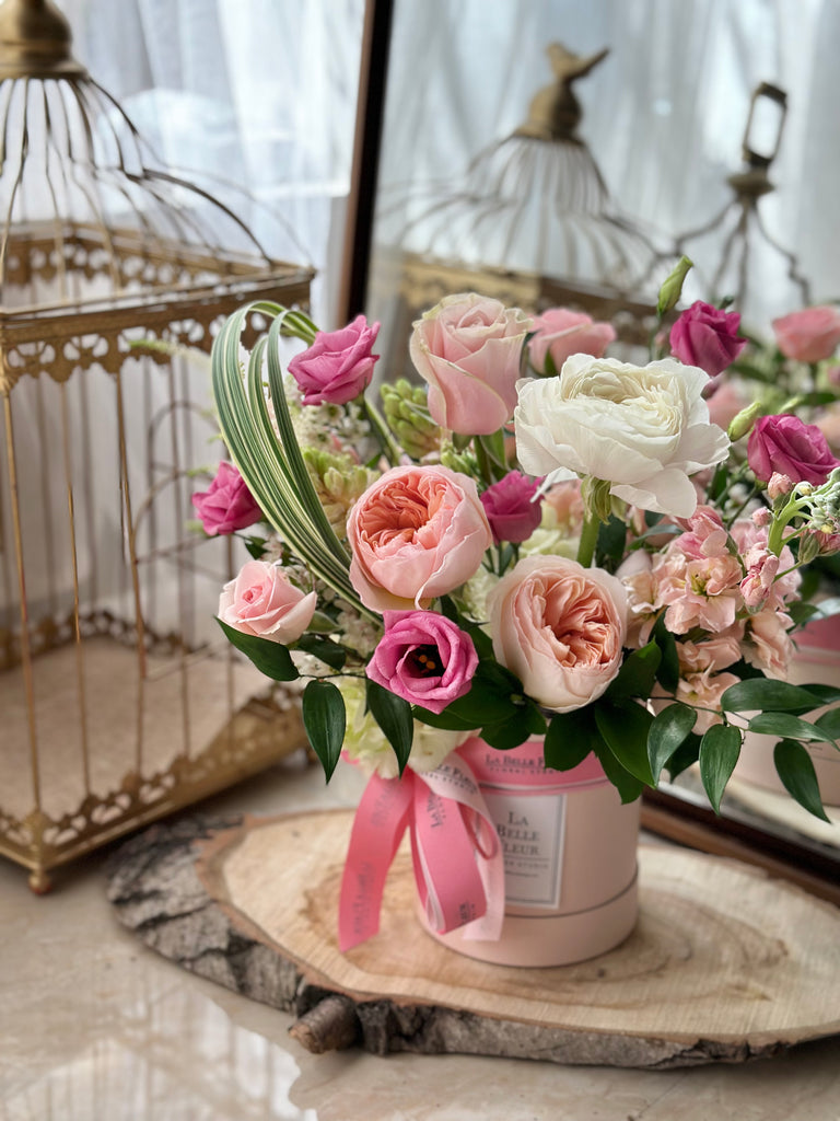 white and peach flower box arrangement