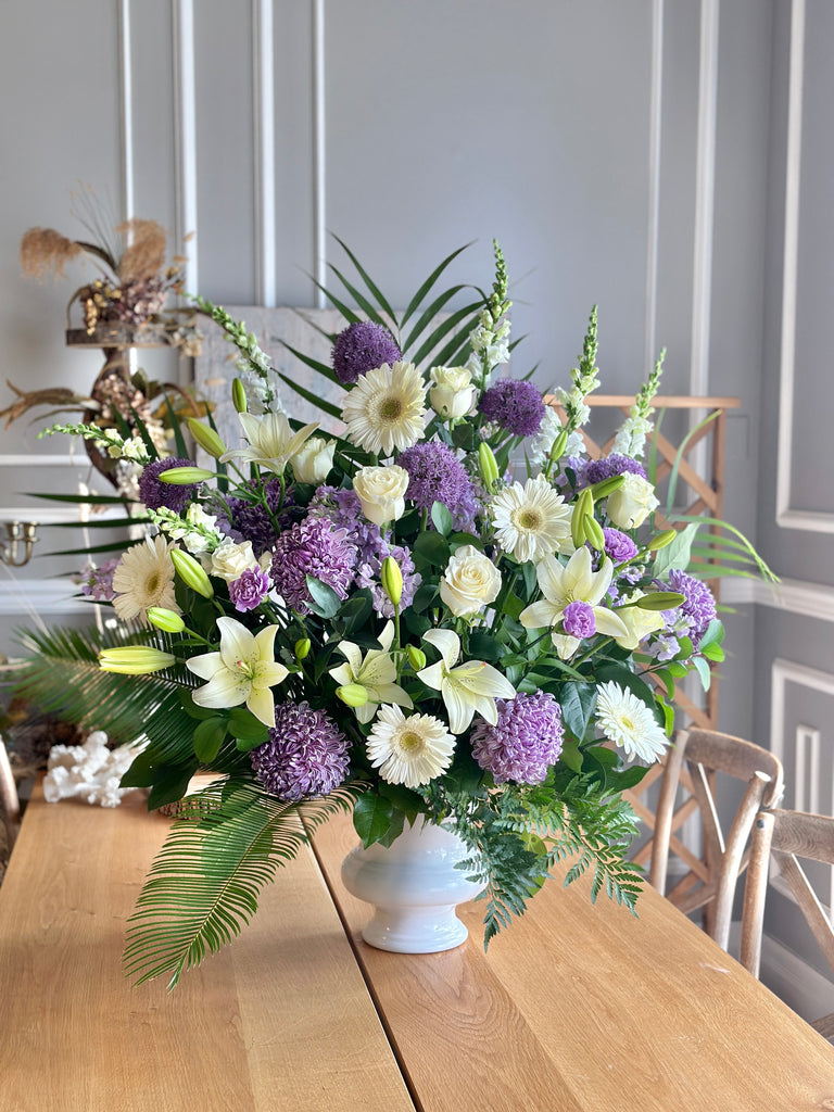 Sympathy white and purple flower arrangement