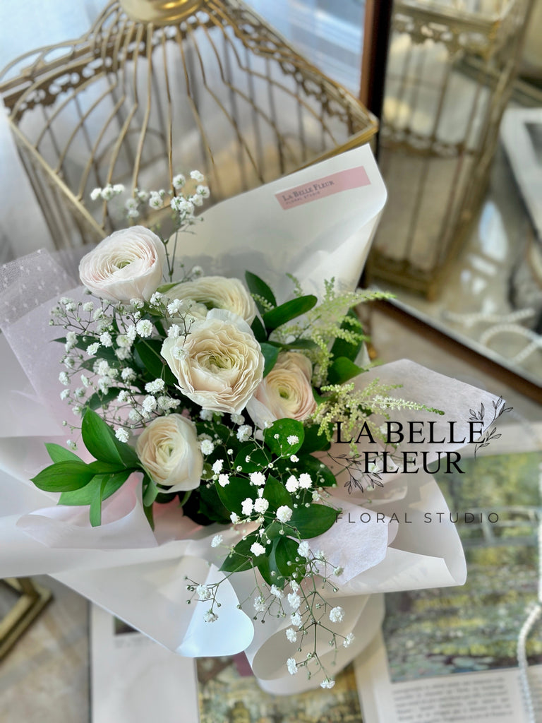 Photo of the white and pink ranunculus bouquet by La Belle Fleur