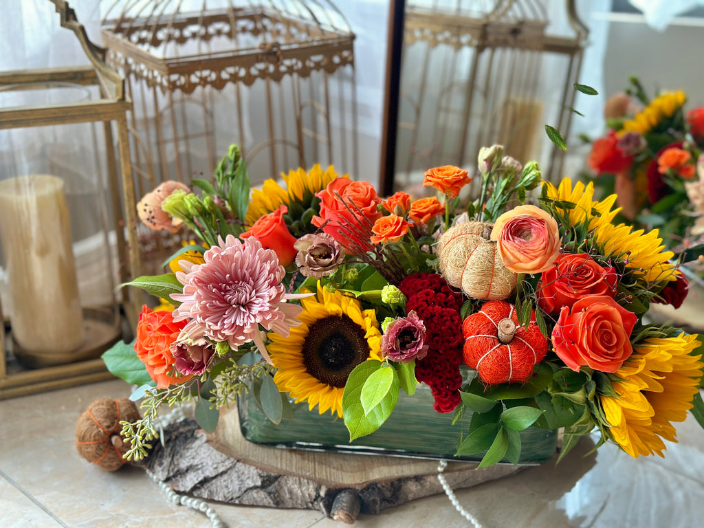 Side angle shot of the Autumn Beauty Sunflower Thanksgiving Centrepiece by La Belle Fleur