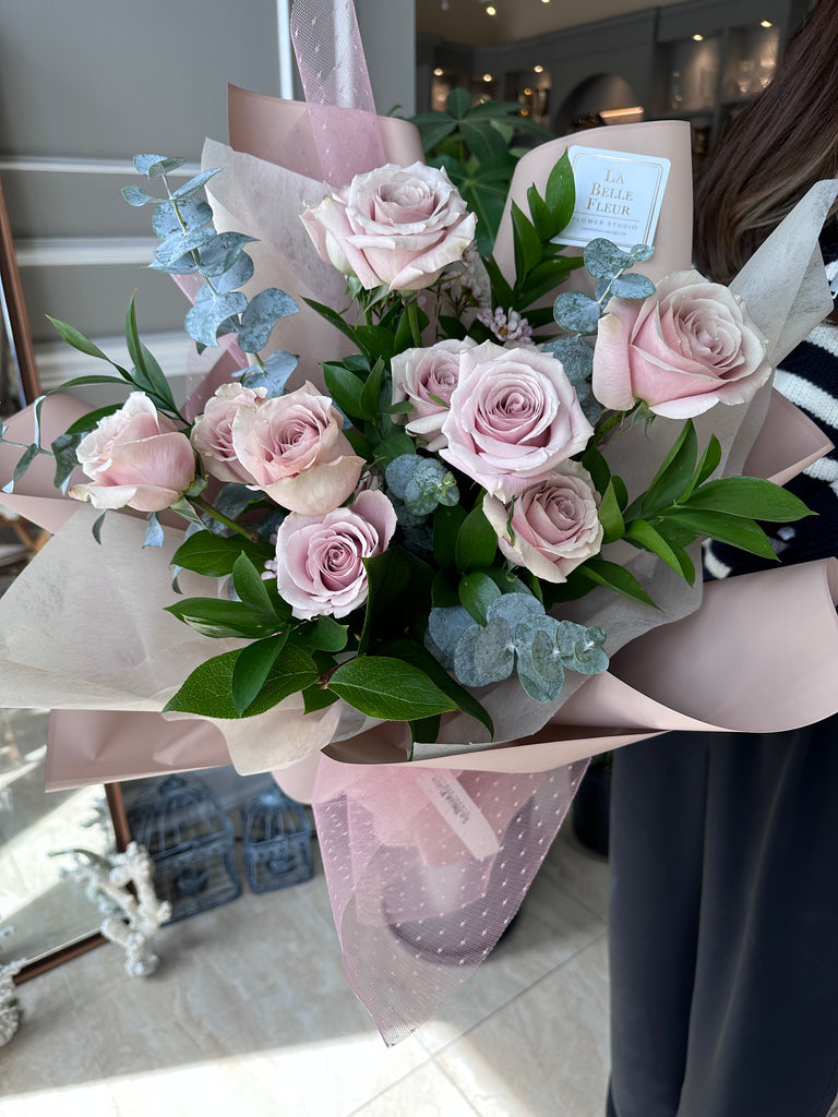 12 Champagne Roses Bouquet with pink wrapping