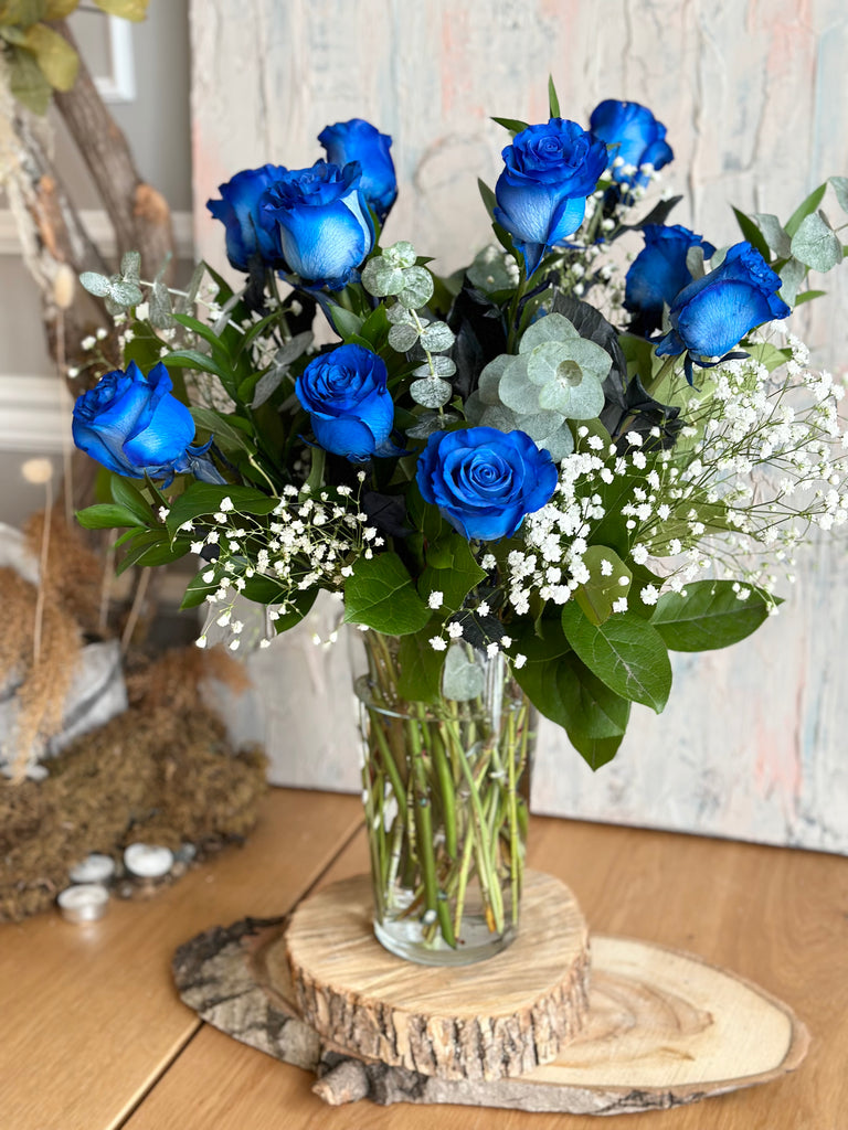 blue roses in vase 